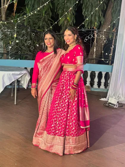 A beautiful moment with my daughter Jothi, both of us in our festive pinks. I'm wearing a classic Banarasi saree, and she is in a custom lehenga. Moments like these are what my brand is all about: family, celebration, and grace.