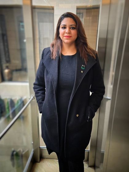 A professional portrait taken during a conference. These events are opportunities to learn, connect, and represent my firm and my mission.