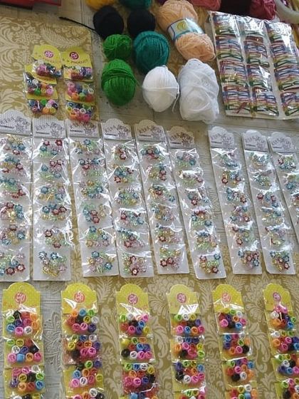 The materials for our hair braiding and beading activity. We bring everything needed to create colorful and fun hairstyles for the party guests.