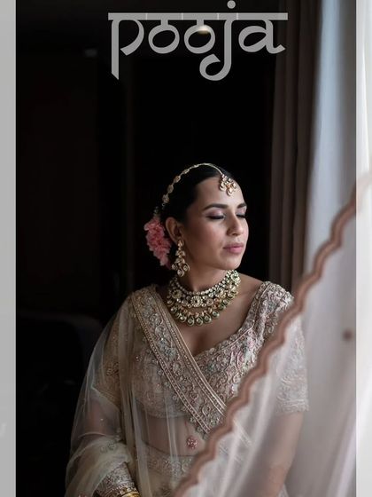 A classic bridal portrait, with the bride looking elegant and poised by the window.
