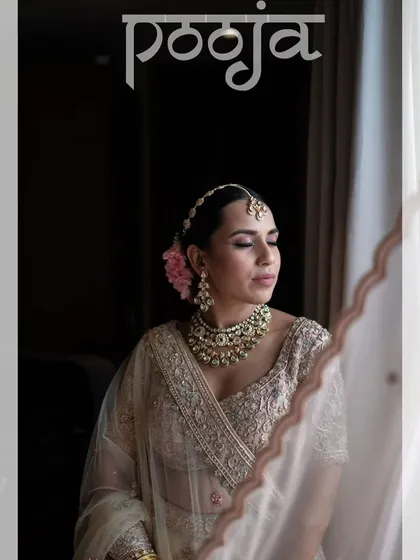 A classic bridal portrait, with the bride looking elegant and poised by the window.