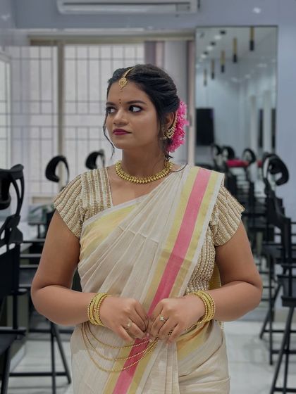 A full shot of the bride, looking elegant and poised. Our students learn how to create looks that are not only beautiful up close but also photograph well.