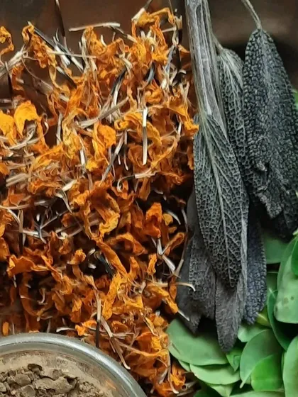 A collection of some of the beautiful, natural ingredients I use in my haircare products. Here you can see dried calendula, sage leaves, moringa, and various herbal powders.
