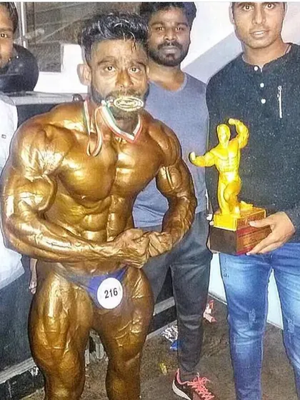 This was me winning the Mr. India title in 2017. This gold medal represents years of relentless training and dedication. When you train with me, you get the experience of a champion who has been on that stage and won.