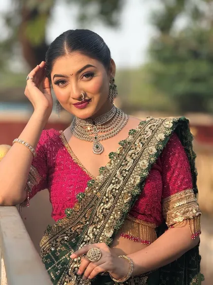 A confident pose from the model. The hairstyle is designed to be chic and modern, suitable for a variety of events from weddings to parties.