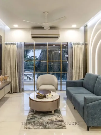 A shot focusing on the living area, with its comfortable seating and large window that brings in natural light. The design is perfect for both relaxing and entertaining.