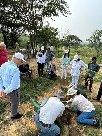 The Bry-Air team and children from local Pathshalas work together during a planting session at Aravali Nagar Van, fostering a sense of community and environmental stewardship.