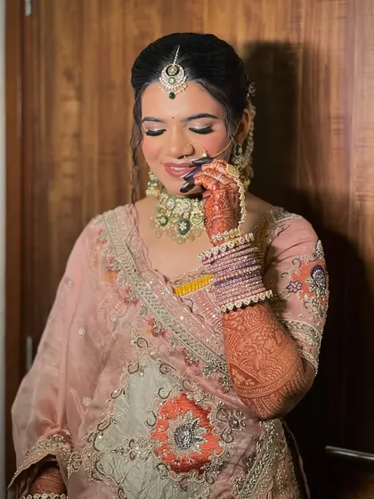 A close-up of the bride's wedding look, highlighting the nath and haathphool from my bridal jewellery collection.