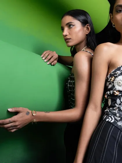A more artistic composition from the Advait shoot, focusing on the interaction between the models and the set. This highlights the textures of the garments and the jewelry styling.