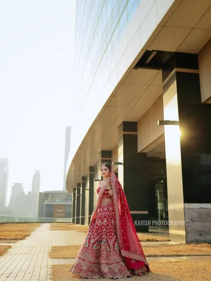 A majestic bridal portrait with a modern architectural backdrop and bright, airy lighting.