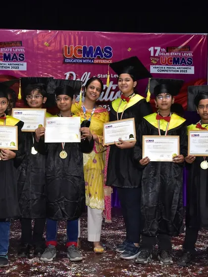A group of our proud graduates holding their certificates at the Delhi State Level Competition. Each certificate represents hours of practice and dedication.