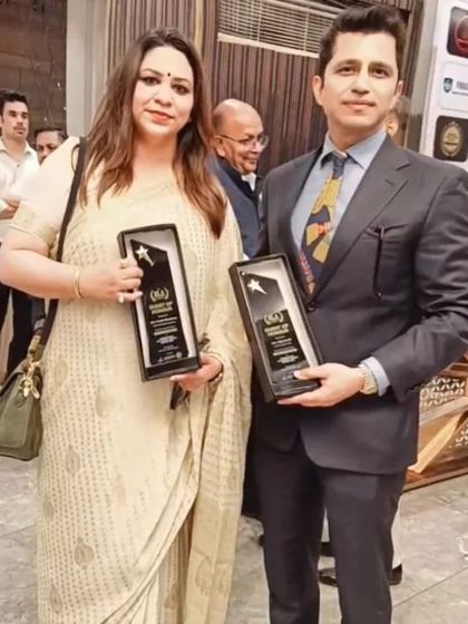 Holding our awards with a fellow recipient. These moments are a celebration of shared commitment to professional integrity and leadership.