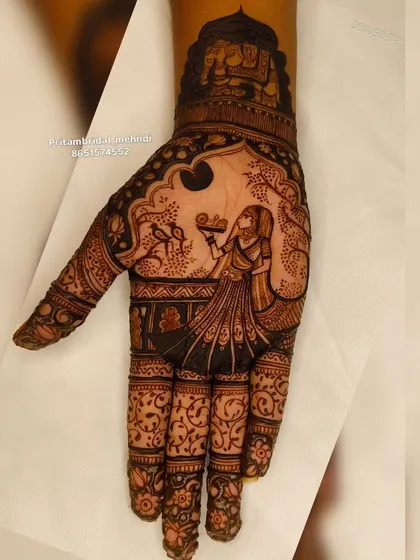 A clear, detailed shot of the Karwa Chauth themed mehndi, showcasing the fine lines and shading that create depth and emotion in the portrait.