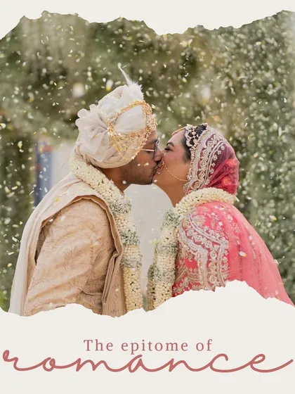 The epitome of romance. A beautiful, intimate kiss shared between the couple after their wedding ceremony.