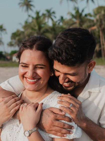 A close-up of a genuine, happy moment. This tight crop focuses entirely on their joyful expressions and the warmth of their embrace.