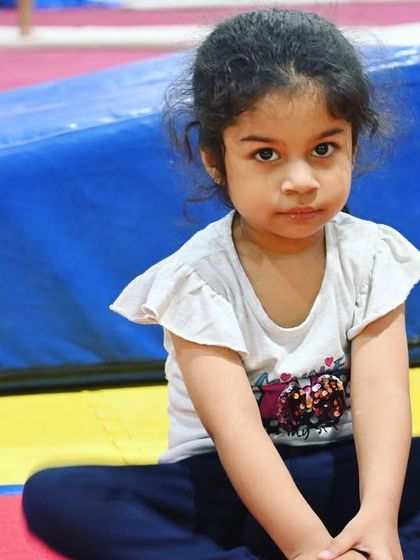 This little gymnast is ready for her session. We create a welcoming atmosphere where every child feels seen and included.
