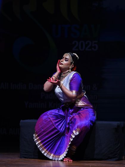 A poignant moment from an Odissi performance, where the dancer uses subtle expressions and postures to convey deep emotions.