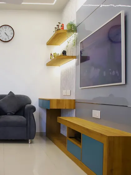 The art-frame TV seen as part of the larger living area, complementing the wooden console and minimalist decor.