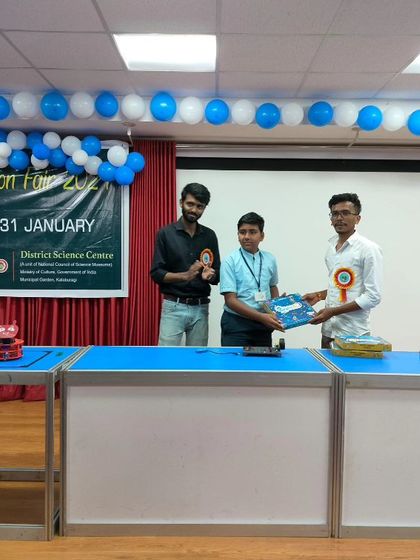 Our team presents a prize to a student participant at the Kalaburagi Innovation Fair. Encouraging participation in science events is a core part of our community engagement.
