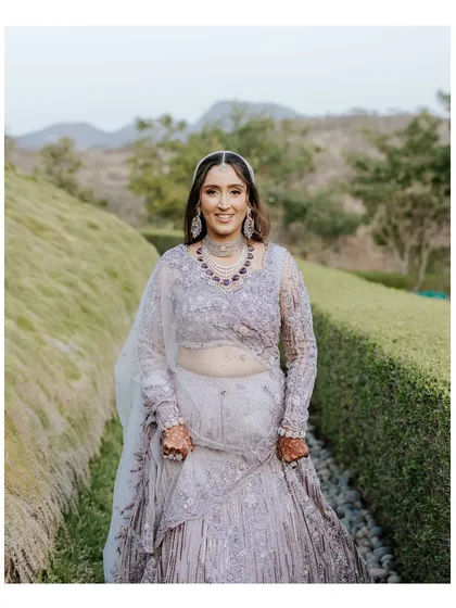 A beautiful, smiling portrait of our bride Sachi. Her lavender lehenga and radiant happiness were the centerpieces of this elegant destination wedding.