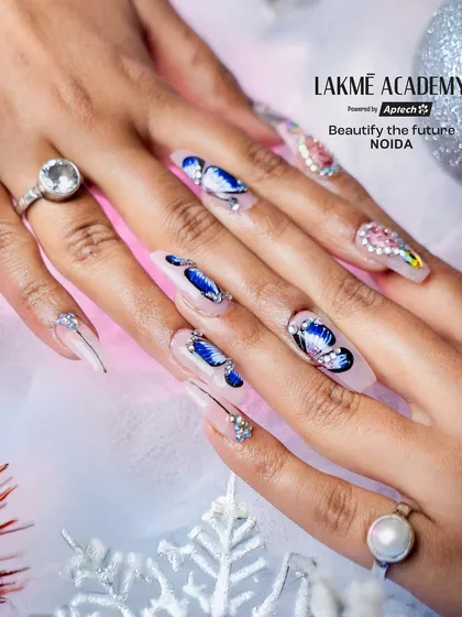 Master intricate, theme-based designs like this stunning butterfly nail art. Our courses cover detailed techniques for creating delicate patterns and applying rhinestone embellishments for a high-end finish.