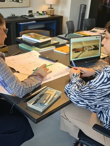 From paper plans to digital renders, every detail is scrutinized. This image captures a typical design review session in our studio, where team members discuss architectural drawings and 3D visualizations to refine the project before it moves to site.