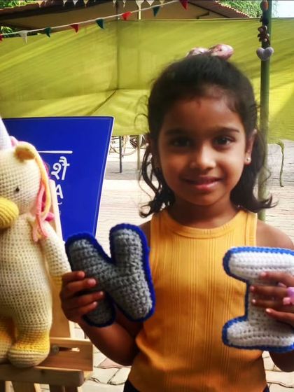 A happy customer with her new unicorn friend and custom crochet name initials. It brings me so much joy to see my creations loved.