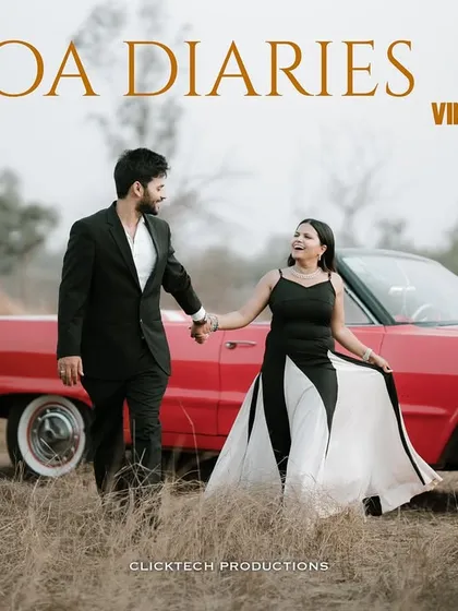 Capturing a moment of vintage romance, this shot features a couple with a classic red convertible in a rustic field, ideal for those looking for an old-school, film-inspired pre-wedding theme.