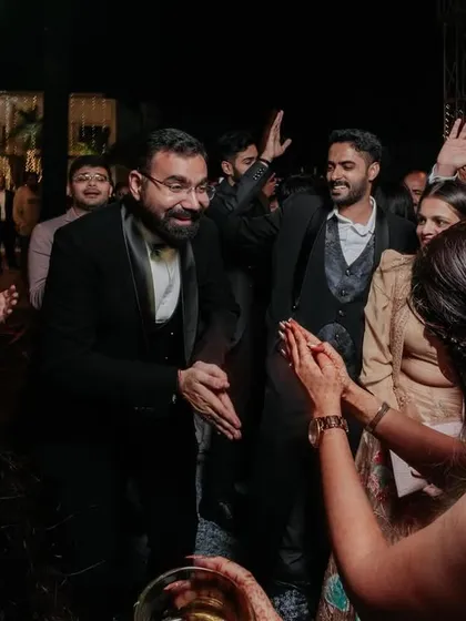 The groom enjoying a dance with his friends and family during the Sangeet night.