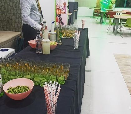 A wide shot of our mocktail station setup in a corporate cafeteria space.