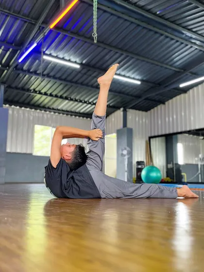 This student demonstrates a standing split, a pose that requires both balance and hamstring flexibility. We work on all aspects of flexibility to create well-rounded athletes.