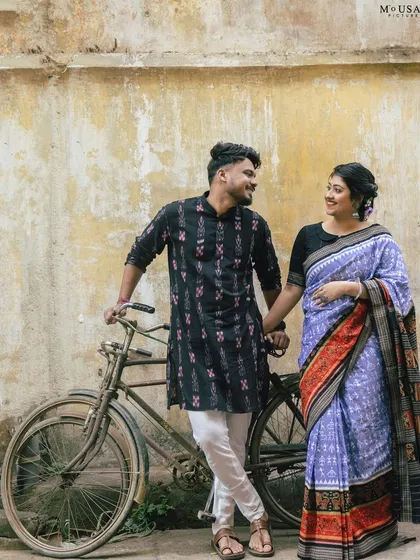 A love story rooted in heritage. We walked the old streets of Sambalpur, using a vintage bicycle as a prop to tell a story that felt both nostalgic and new. The bride's Sambalpuri saree adds a layer of beautiful, personal culture to their pre-wedding portraits.