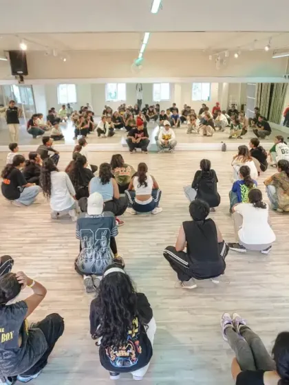 A wide shot of the packed studio during a Collab Series workshop, with students fully immersed in the learning experience.