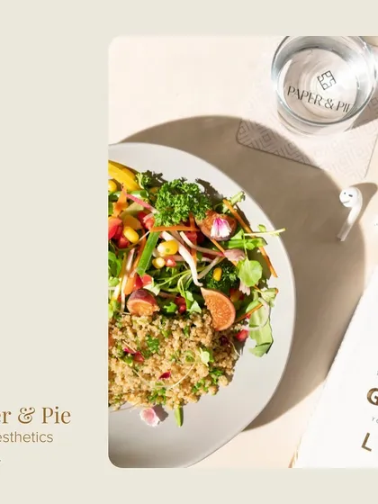 The aesthetics of Paper & Pie. A healthy quinoa salad, a good book, and our branded coaster, all bathed in natural light.