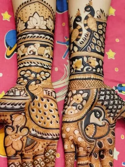 A festive design celebrating Teej, with 'Happy Teej' written on the palm. The design features beautiful peacocks and traditional motifs.