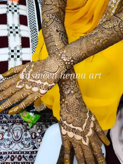 Faiza's mehndi journey, from the fresh paste to the final look. This design features a mix of geometric and floral patterns, with names personalized on the palms.