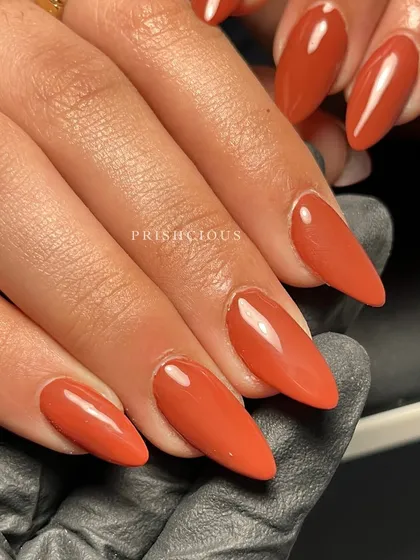 A final shot of these gorgeous brown nails, held by me to show the finished product.