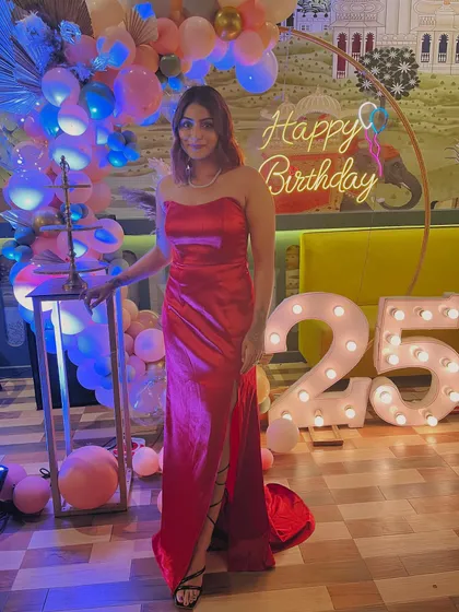 One more shot of the birthday look. This red gown is a perfect example of how a custom-made outfit can make you feel special on your big day.