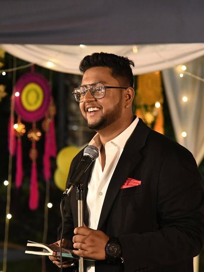 A candid smile during a more formal event. It's not always the aggressive rapper persona.