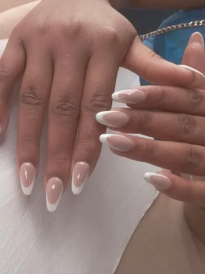 A classic French manicure on long, elegant almond-shaped extensions. This is a timeless look that I have perfected for hundreds of clients.