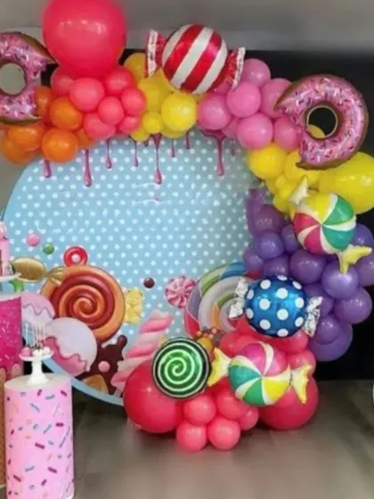 A sweet and colorful Candyland theme, bursting with fun. This decoration includes a custom backdrop, vibrant balloon arrangements, and oversized donut and candy props to create a playful atmosphere.