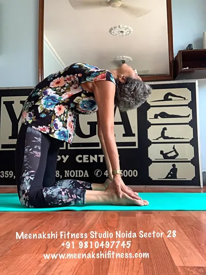 Ustrasana, or Camel Pose. This deep backbend stretches the entire front of the body and opens the heart center.