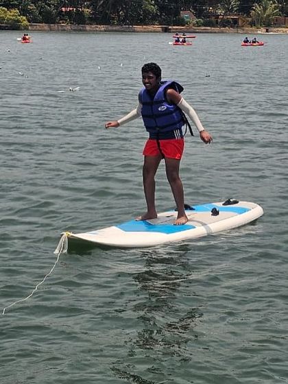 Another successful stand-up paddleboarder enjoying the activity during our sailing and surfing camp.