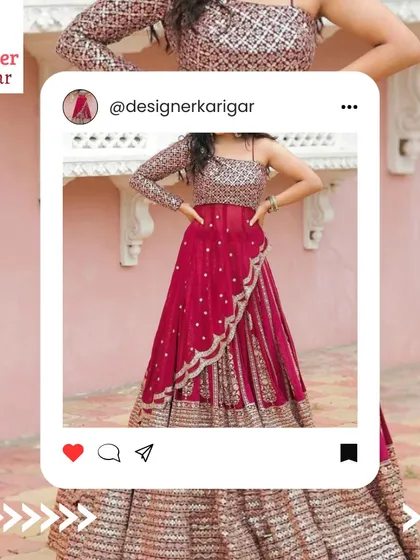 A striking red lehenga with an asymmetrical, single-sleeve blouse. This modern design is perfect for a bride who wants to make a statement.