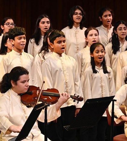 The choir and string ensemble perform together, a beautiful blend of voices and instruments. These collaborations are a highlight of our concert season.