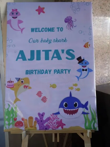 A personalized welcome sign for Ajita's Baby Shark birthday party. It's the small details like this that make guests feel special from the moment they arrive.