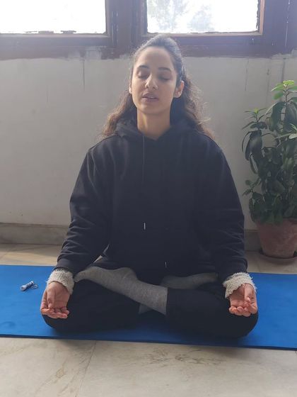 Seated in Padmasana for meditation. A consistent and mindful practice, whether through movement or stillness, is the path to self-analysis and transcending your own perceived limits.