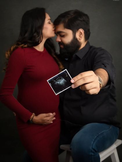 A sweet announcement photo with your sonogram picture. The kiss on your forehead adds a layer of love and tenderness to this special memory.