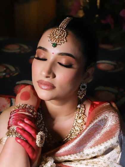 Another artistic shot of the bride, her eyes closed, highlighting the serene beauty of the moment.
