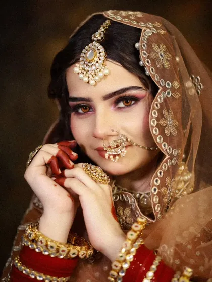 A stunning close-up portrait of a bride with captivating eyes. The makeup focuses on defining the eyes with kohl and soft eyeshadow, a classic technique you will master.